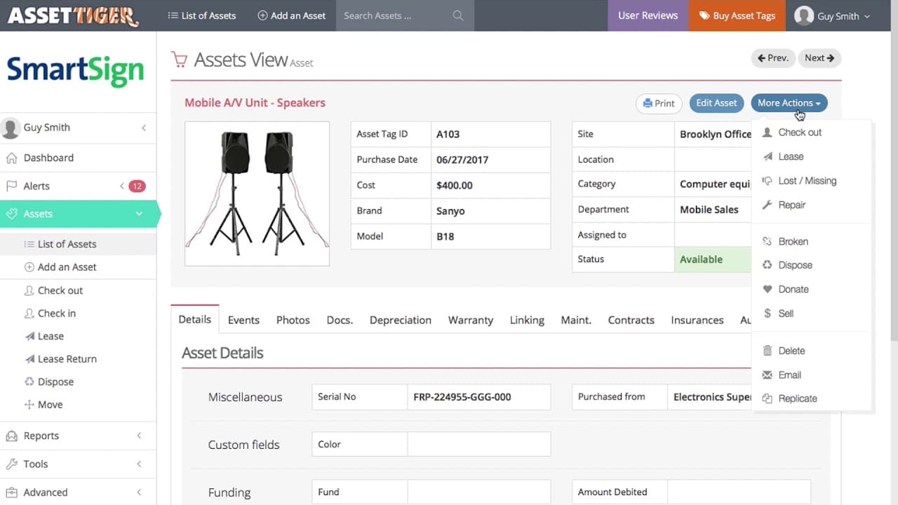 The AssetTiger asset tracking interface shown in a browser and on a mobile phone.