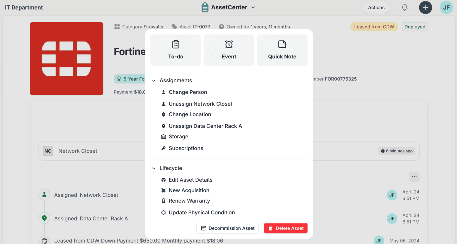 The actions menu open on a Fortinet device record in AssetCenter, offering to-do, event and quick note shortcuts alongside assignment and lifecycle actions.