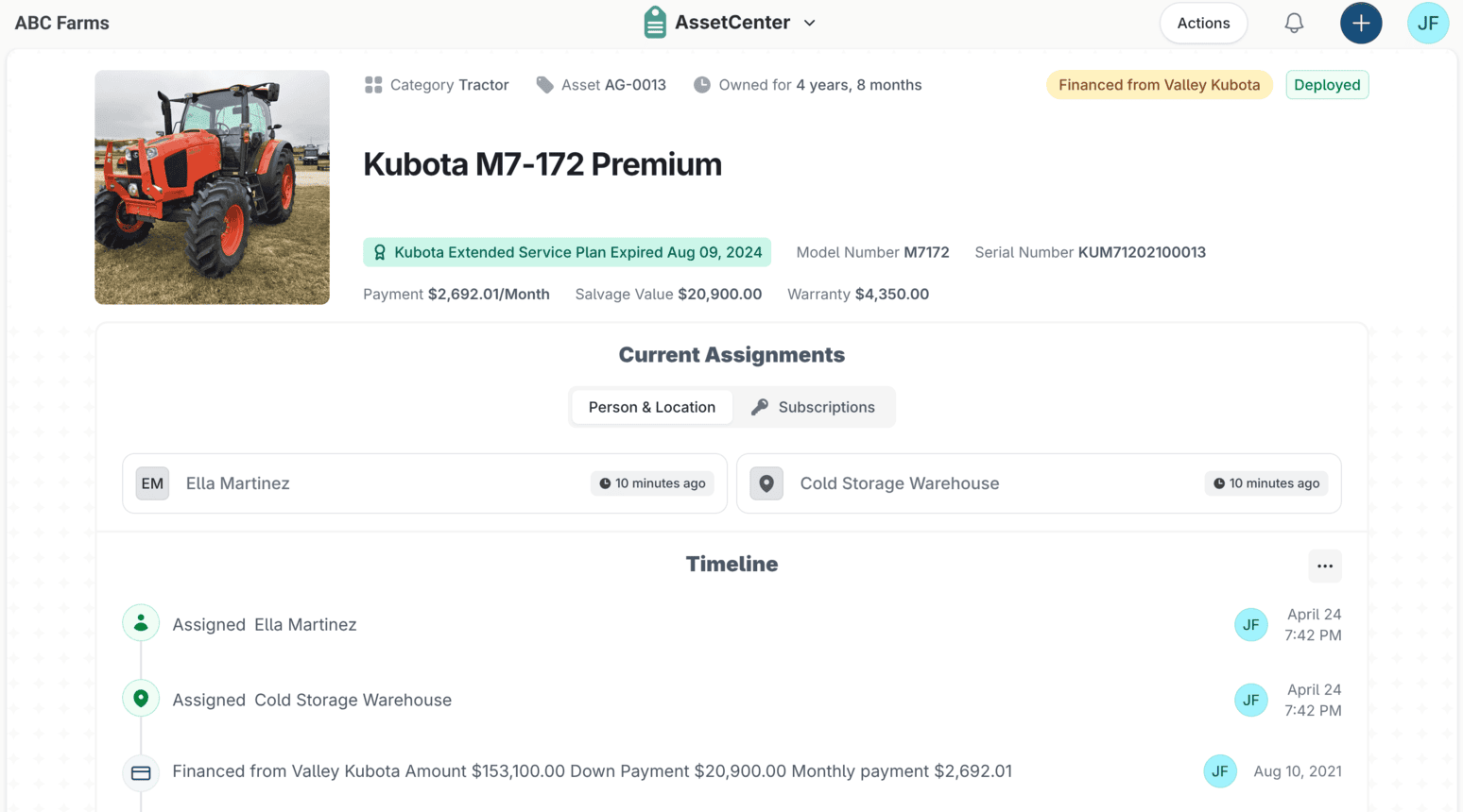 An asset record in AssetCenter for a Kubota M7-172 Premium tractor, showing its category, service plan, payment and warranty figures, its current person and location assignments, and a timeline of assignment and financing events.