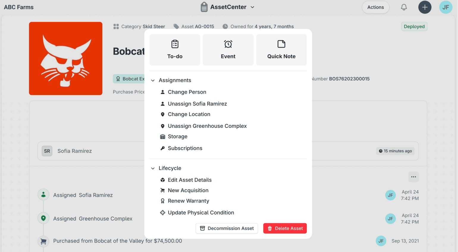The actions menu open on a Bobcat skid steer record in AssetCenter, offering to-do, event and quick note shortcuts alongside assignment and lifecycle actions such as change person, change location, renew warranty and decommission.